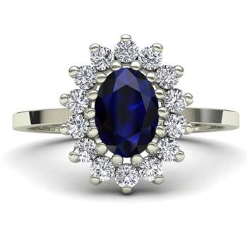 Anillo con zafiro azul central y halo de diamantes